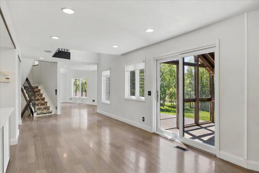 Main level open layout with screened porch