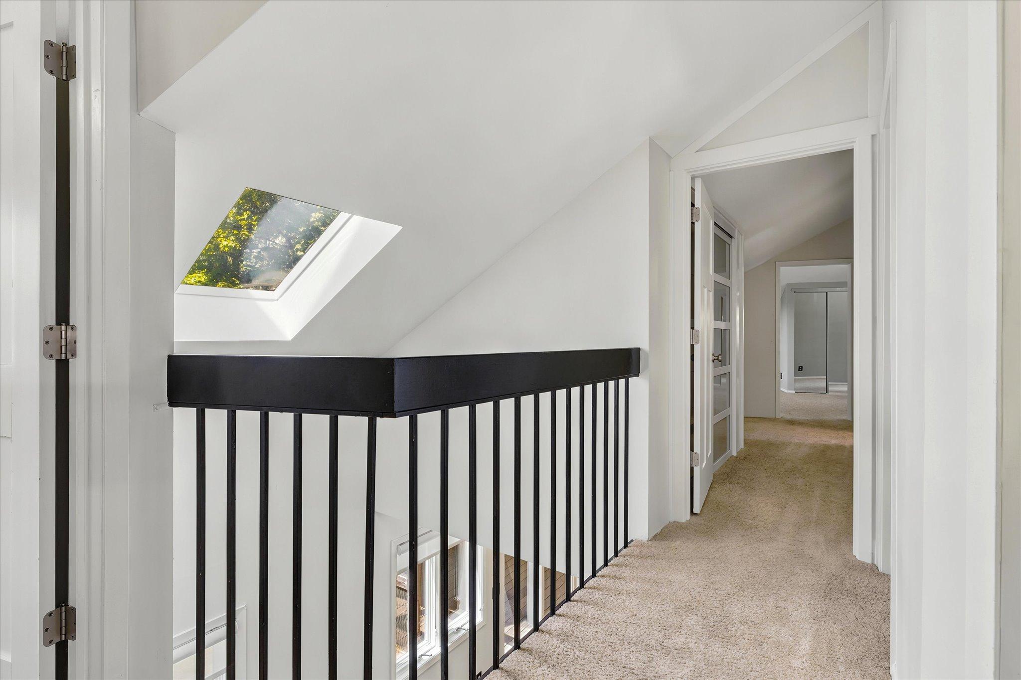 Upper balcony and drenched in sunlight - great skylights. *Keep home as primary, or Approved for ADU/guest house - modifications to complete with your builder. Survey available with new placement for your dream home!
