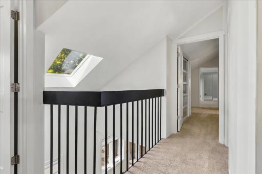 Upper balcony and drenched in sunlight - great skylights. *Keep home as primary, or Approved for ADU/guest house - modifications to complete with your builder. Survey available with new placement for your dream home!