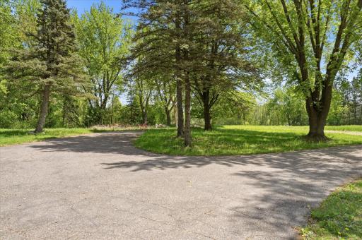 Treelined private drive to your own piece of heaven on 7 acres.
