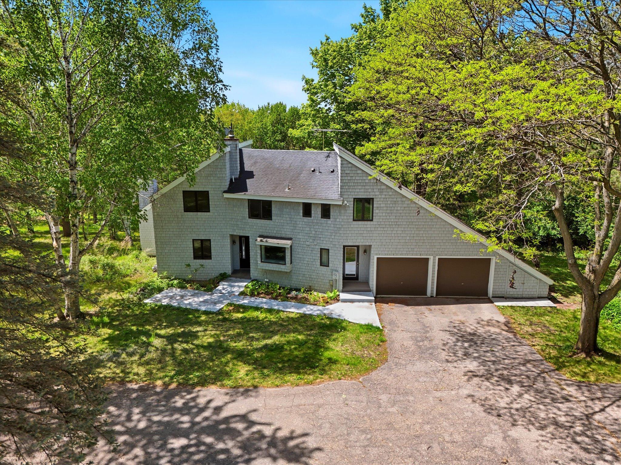Absolutely stunning acreage estate with treelined private drive to a 7 acre piece of heaven