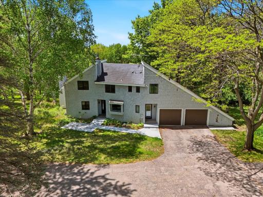 Absolutely stunning acreage estate with treelined private drive to a 7 acre piece of heaven