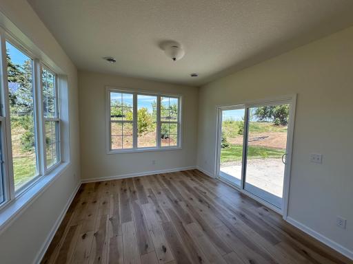 Morning room leading out to a private backyard patio