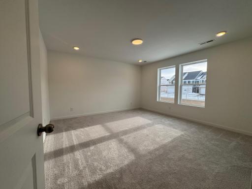 Primary Bedroom. Photo is of a similar Lowry home.