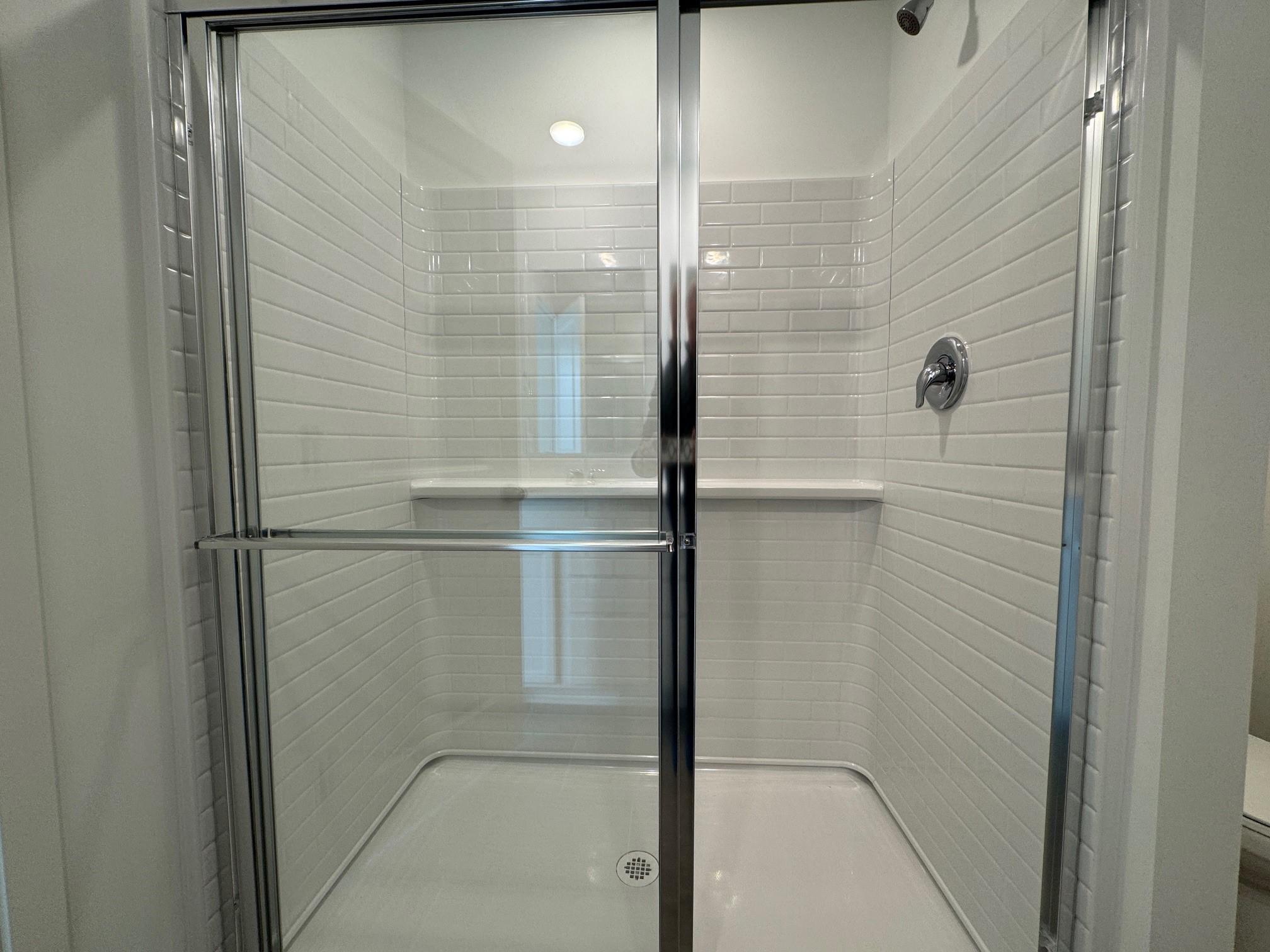 Primary Bathroom Shower. Photo is of a similar Lowry home.