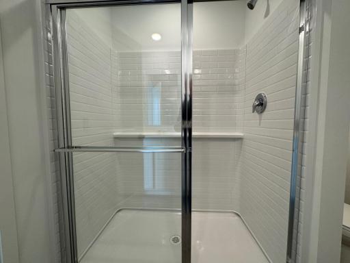 Primary Bathroom Shower. Photo is of a similar Lowry home.
