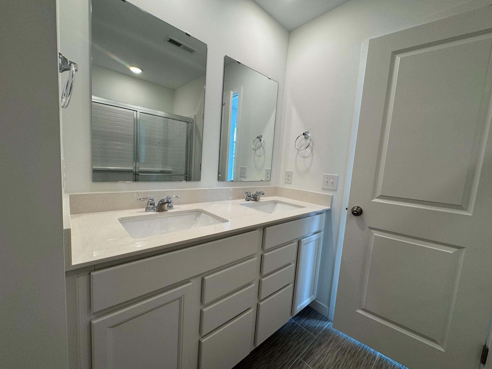 Primary Bathroom. Photo is of a similar Lowry home.