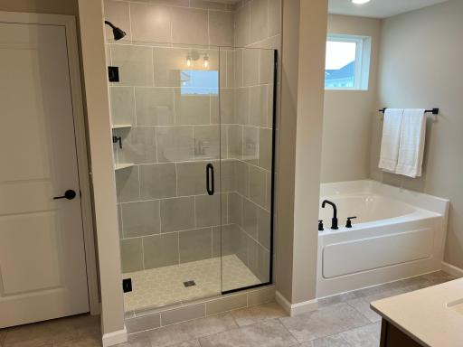 Same floorplan - staged. Primary bathroom