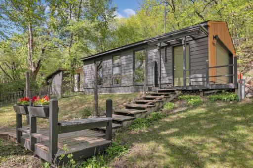 Garage is deep with additional storage along the backside and enclosed chicken coop and run. Garage also has large windows with lake views!