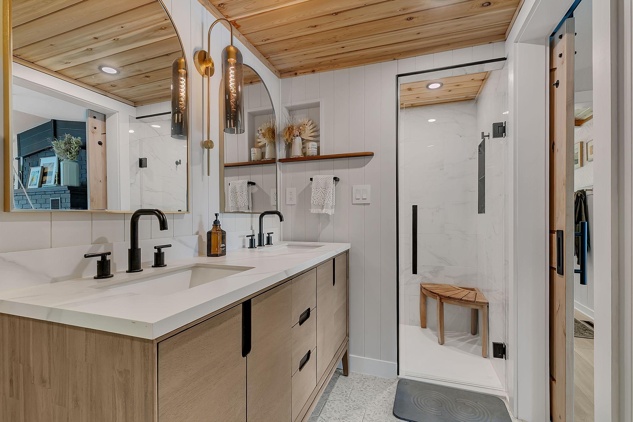 Upstairs main bathroom with double sinks and walk in shower