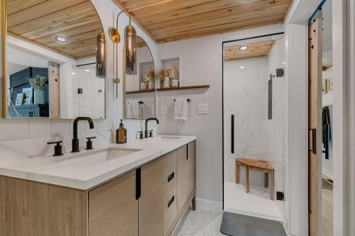 Upstairs main bathroom with double sinks and walk in shower
