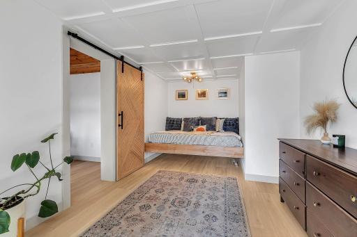 Bedroom 1 on main level - Currently configured with daybed and office. Previously setup as master with large walk-in closet
