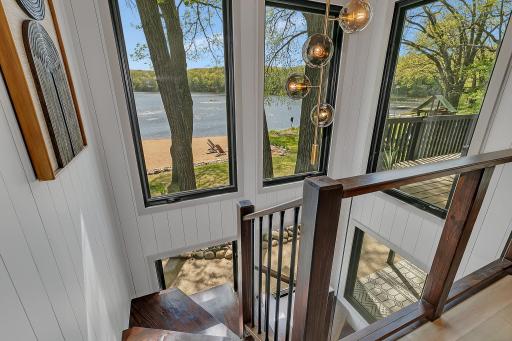 Custom staircase with glass rail system to maximize outdoor views