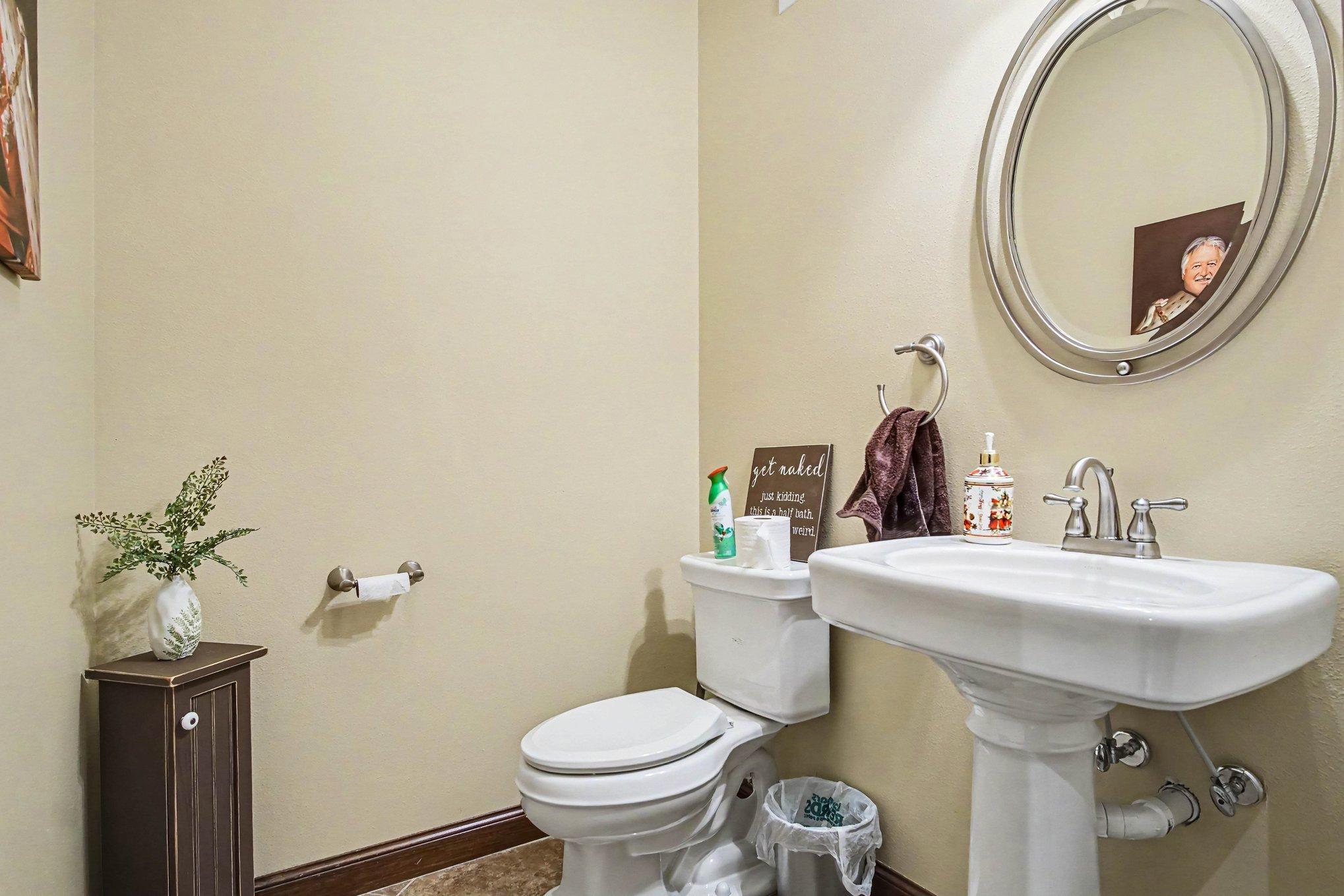 Half bath located just inside garage door