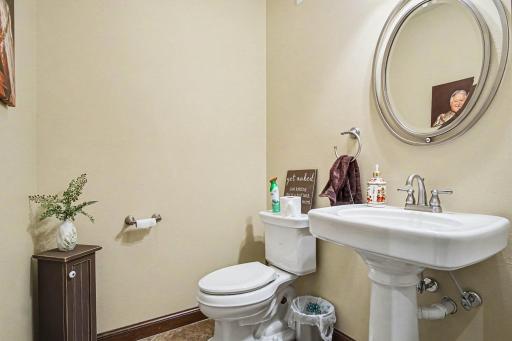Half bath located just inside garage door