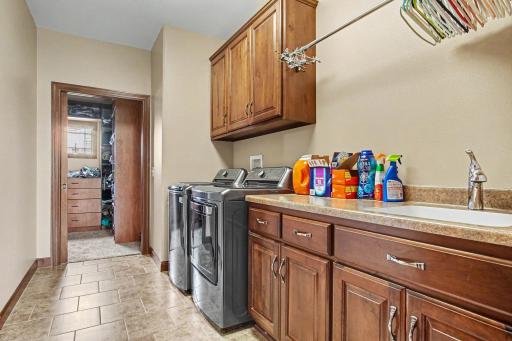 Laundry room on main floor- plenty of storage cabinets/countertops