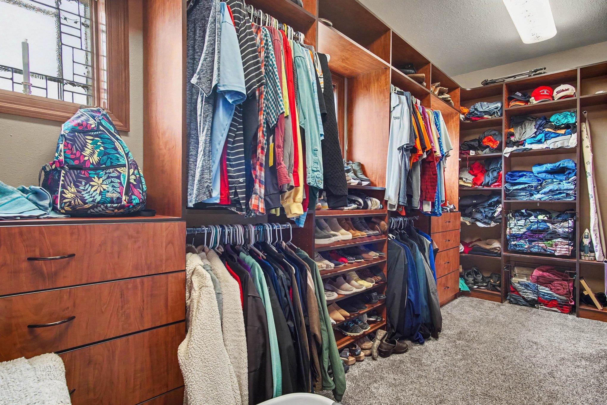 Walk in closet opens into laundry room