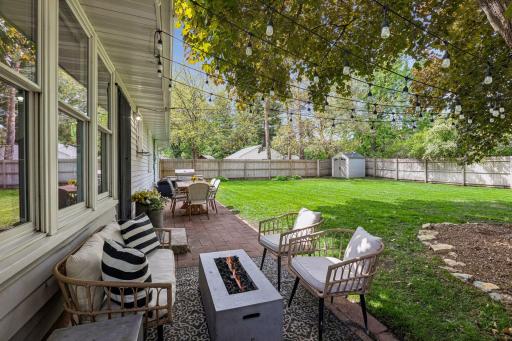 Step outside to enjoy the patio overlooking the newly fenced backyard, along with a one-car garage offering convenient attic storage.