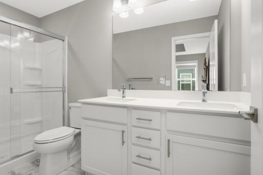 Owner's 3/4 private bath has shower and dual vanity.