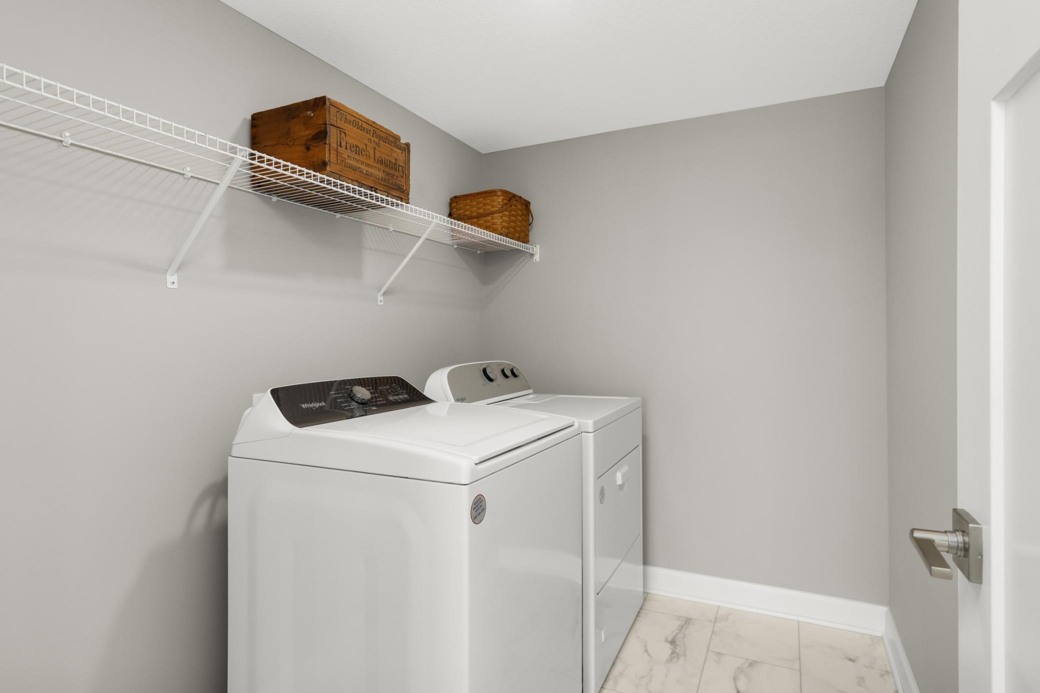 Lower level laundry. Extra storage here, too.