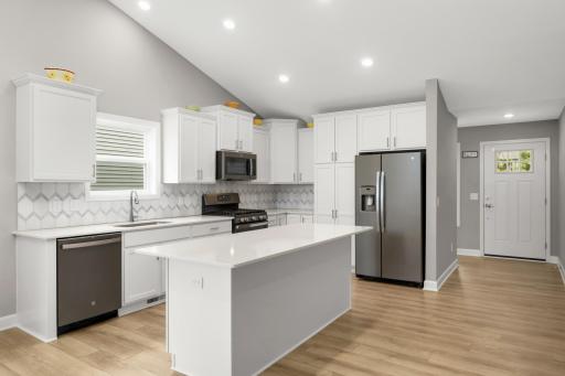 Welcoming foyer at the front entry and walk into the cook's kitchen!