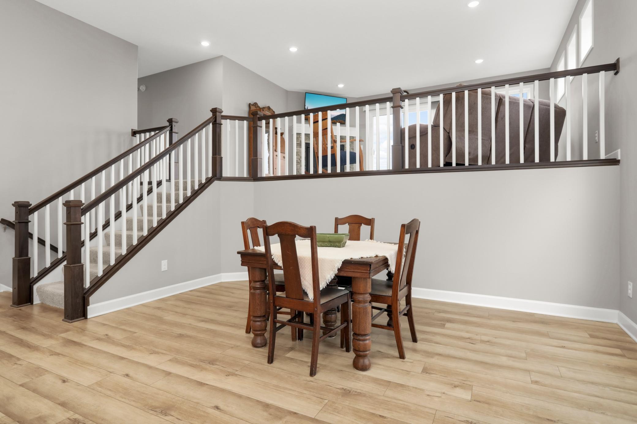 Directly adjacent to the kitchen is the spacious dining area. Plenty of room for hosting and open to the living room up a level.