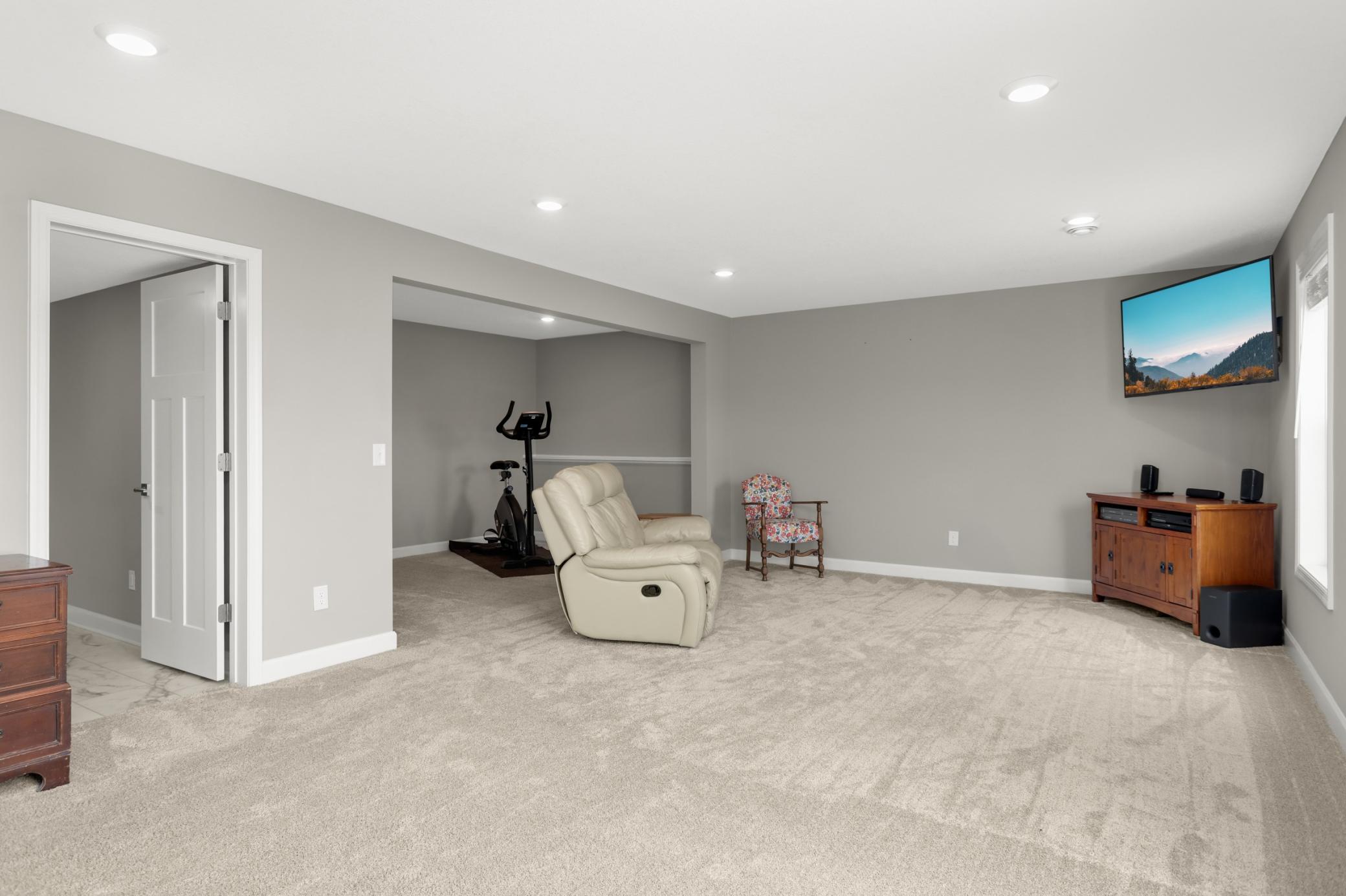 Down the stairs to the lower level huge family room and more!