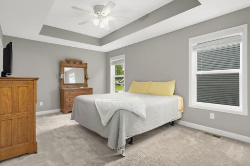 Just down the hall in the upper level is the owner's suite. Huge bedroom with tray vaulted ceiling, ceiling fan, large windows and private bath/walk-in closet.