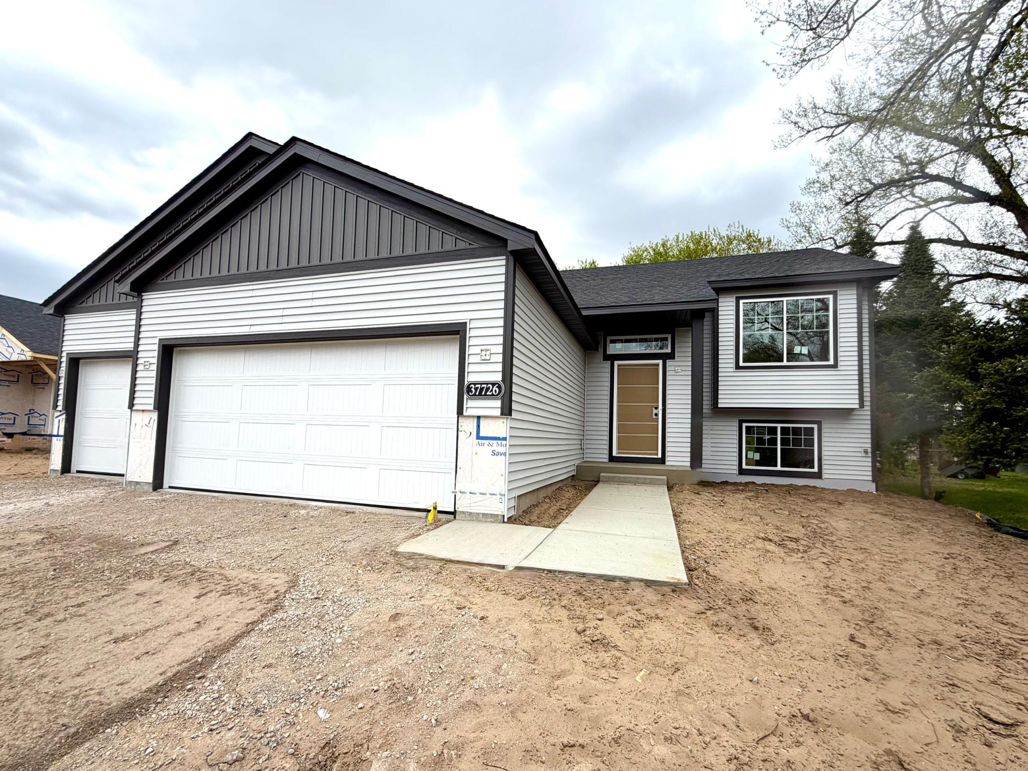 37726 Greenway Ave, North Branch - Photo of actual home. Sod and Irrigation Included!