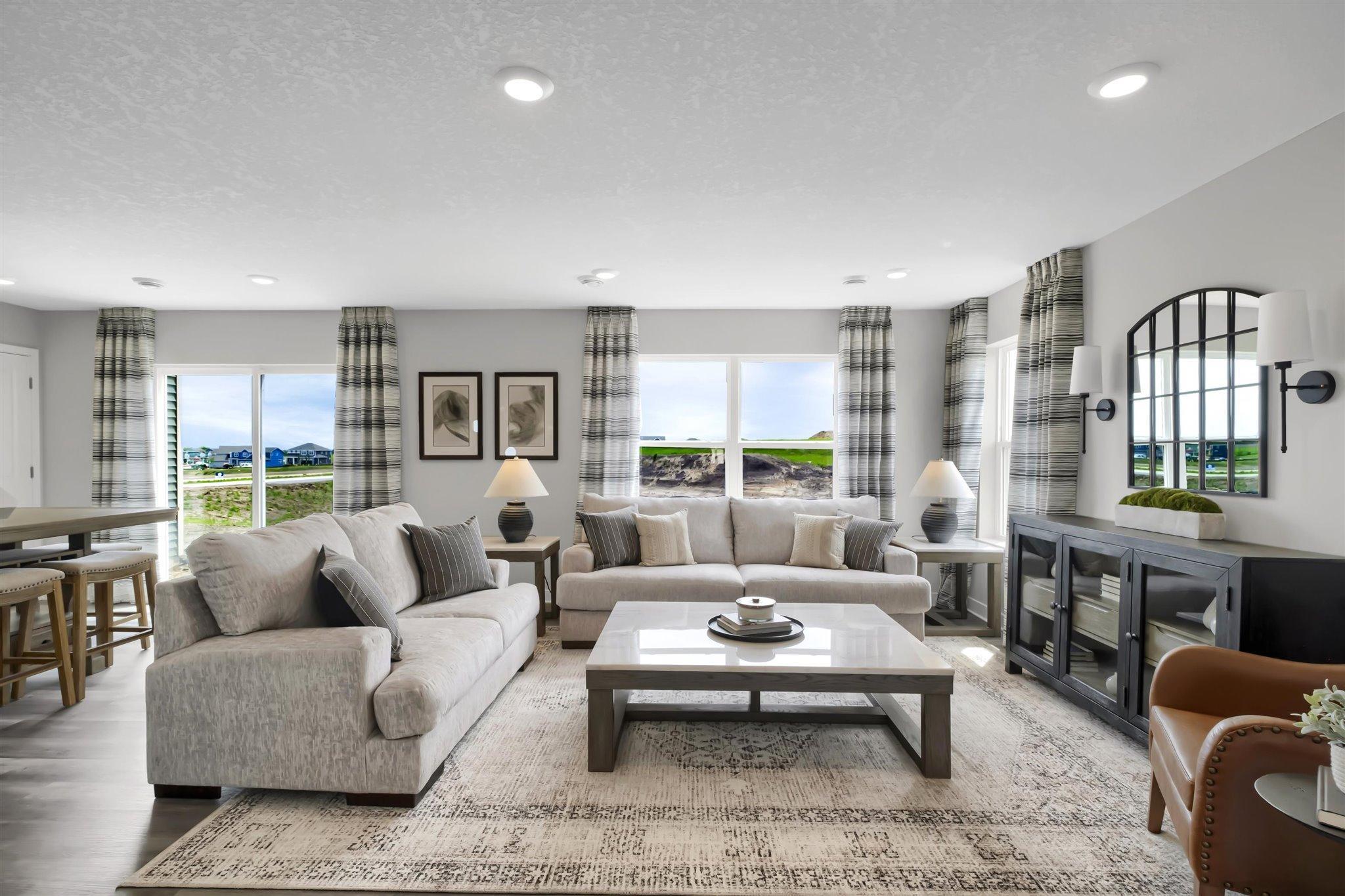 Welcome to 2135 Highview Ridge Ct! The Duet by DR Horton is open and airy on the main floor.