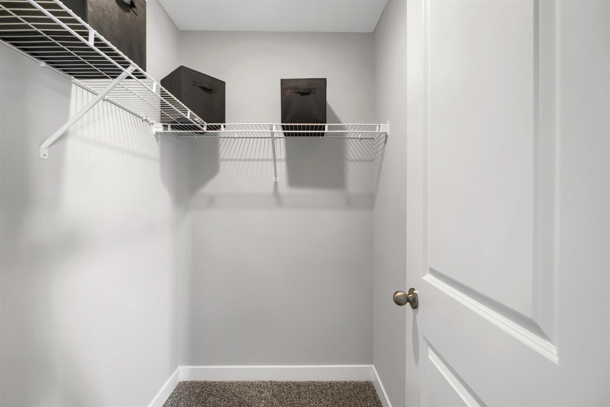 Primary bedroom walk in closet.