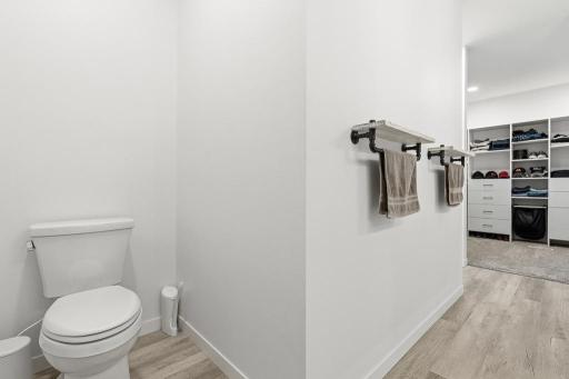 Toilet is tucked around the corner for privacy - wait until you see the walk-in closet!
