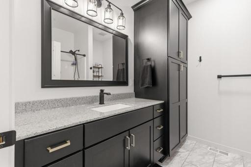 The main floor full bathroom offers plenty of space to prepare for the day