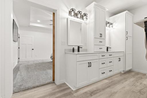 Dual sink vanity with plenty of storage for both! The vanity under-lighting also elevates this space and makes it easy to navigate at night