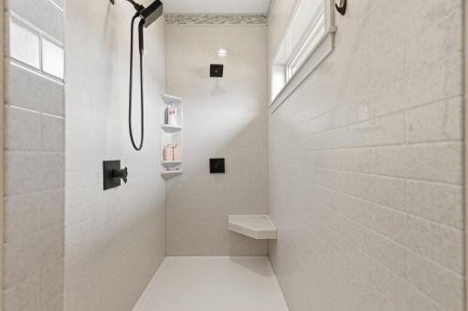 Beautiful, spacious onyx walk-in shower for the primary
