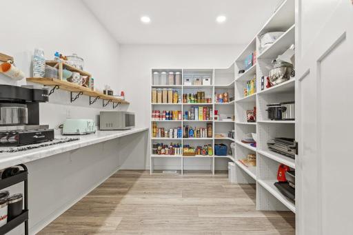 This will be one of your favorite features - this large walk-in pantry offers an easy storage solution for all of your dry goods and appliances without being an eye-sore on your countertops!