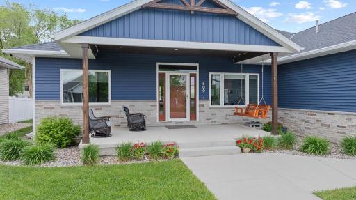 Front porch goals ?? Covered, spacious, and complete with a swing