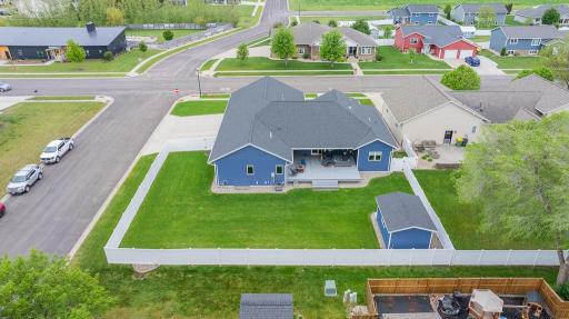 Spacious, fully fenced backyard designed for privacy, play, and entertaining