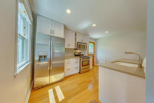 Updated kitchen with new cabinets, SS appliances, quartz counters