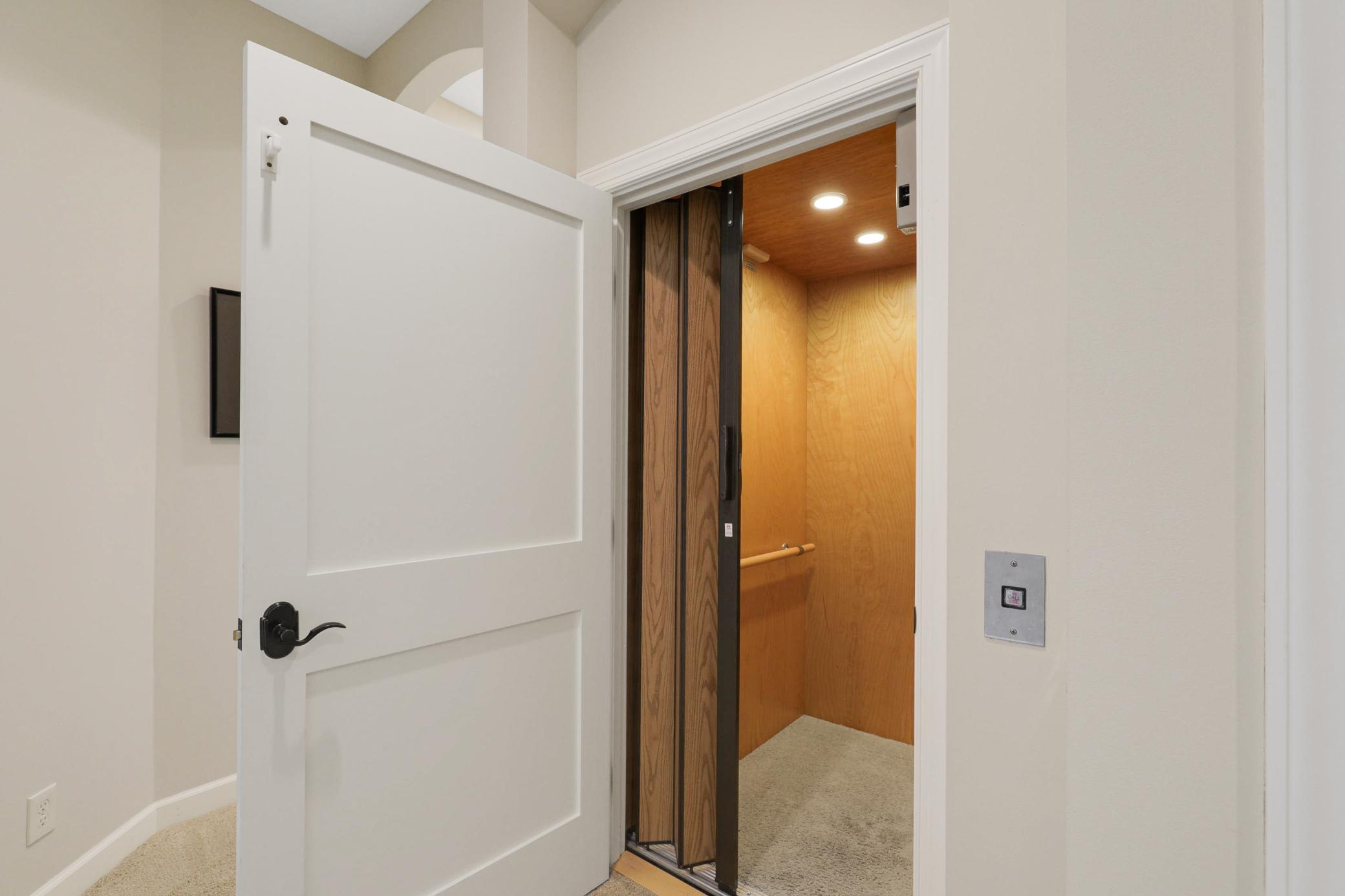 A private elevator provides access to the garage, main floor, and lower level.
