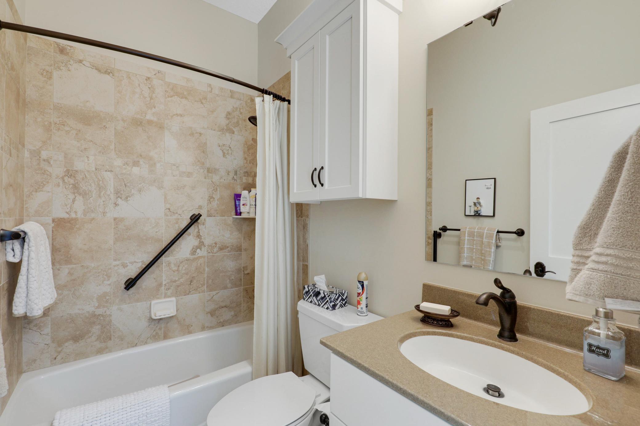 A second main-floor bedroom offers its own full private bath and an oversized walk-in closet, and the versatile office/flex room can be easily converted into a fourth bedroom with the simple addition of a closet.