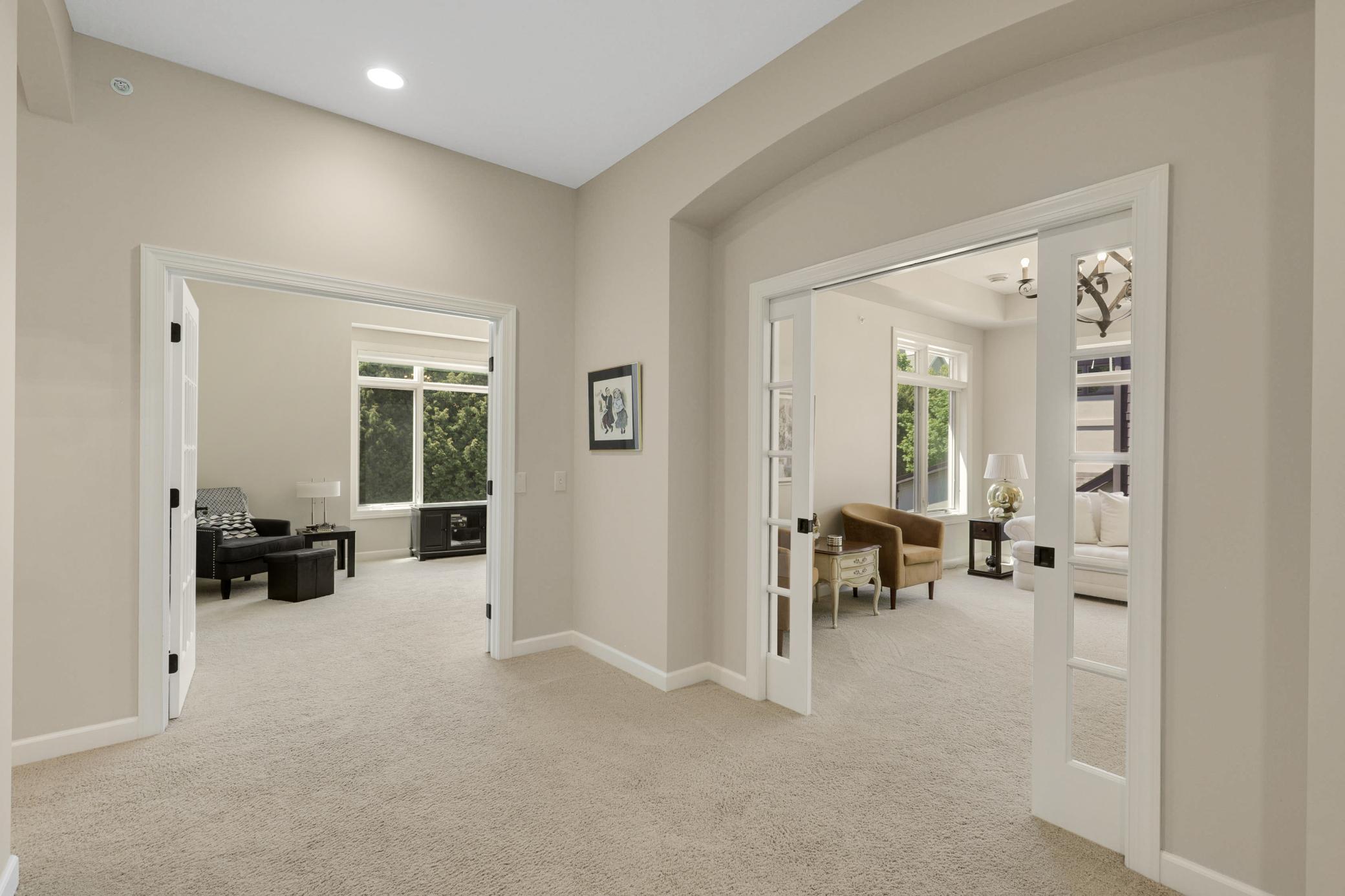 The bright family room, also located on the main floor, is enclosed by sliding glass pocket doors.
