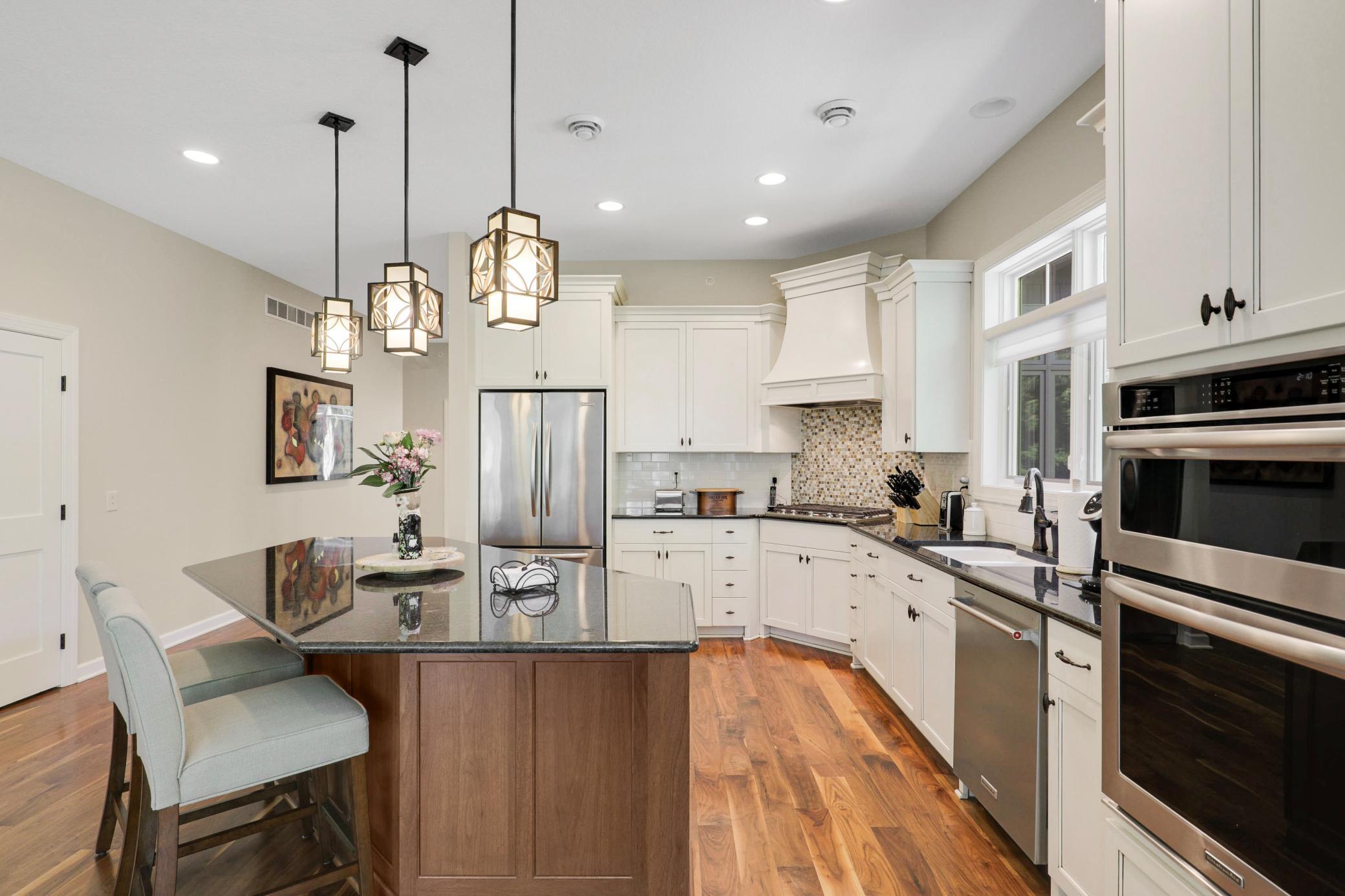 Enjoy cooking in your gourmet kitchen which showcases stone countertops, ample cabinet storage and stainless steel KitchenAid appliances.