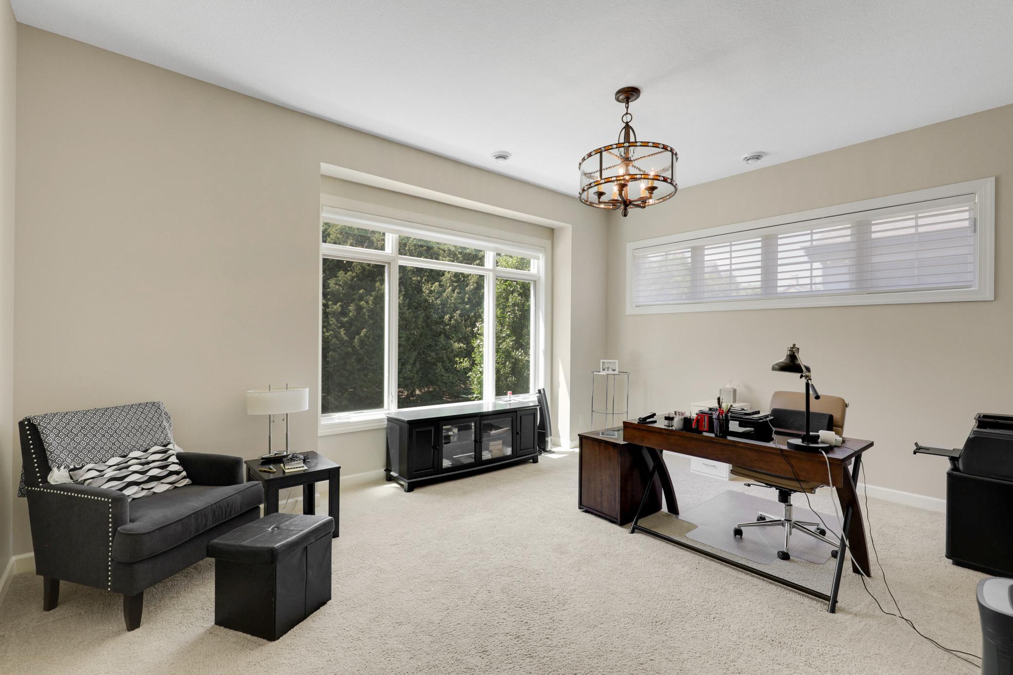 A second main-floor bedroom offers its own full private bath and an oversized walk-in closet, and the versatile office/flex room can be easily converted into a fourth bedroom with the simple addition of a closet.