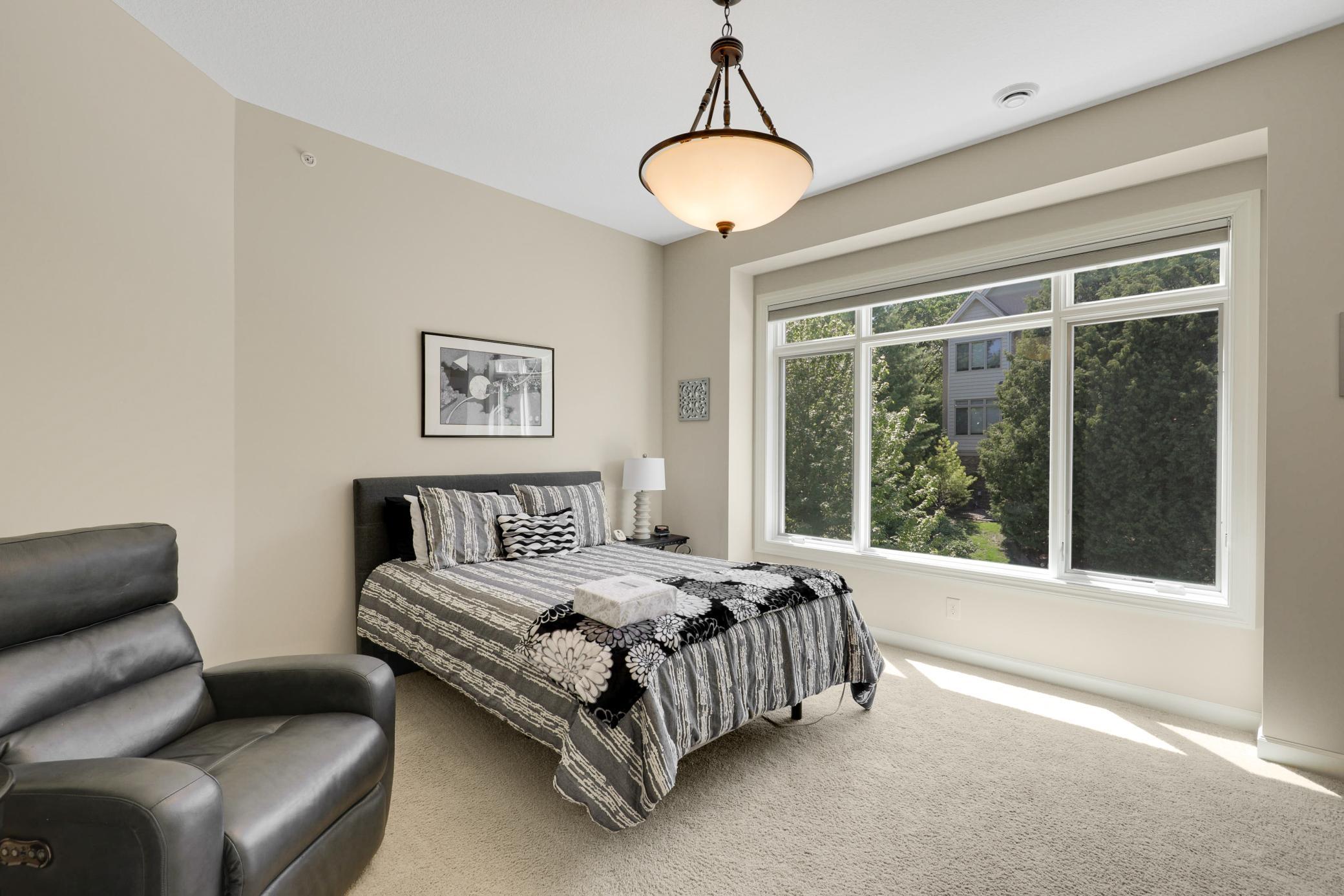 A second main-floor bedroom offers its own full private bath and an oversized walk-in closet, and the versatile office/flex room can be easily converted into a fourth bedroom with the simple addition of a closet.
