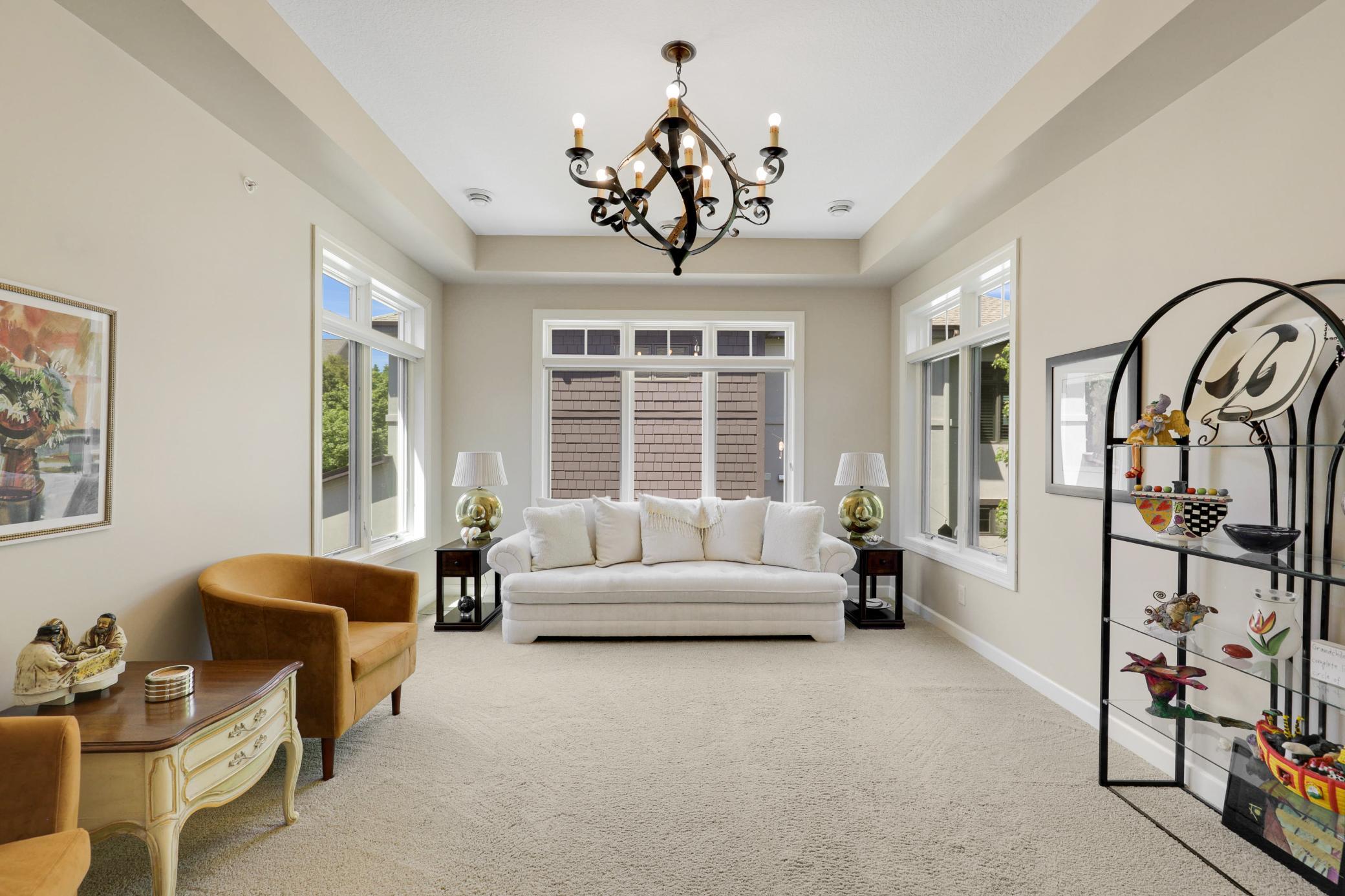 The bright family room, also located on the main floor, is enclosed by sliding glass pocket doors.