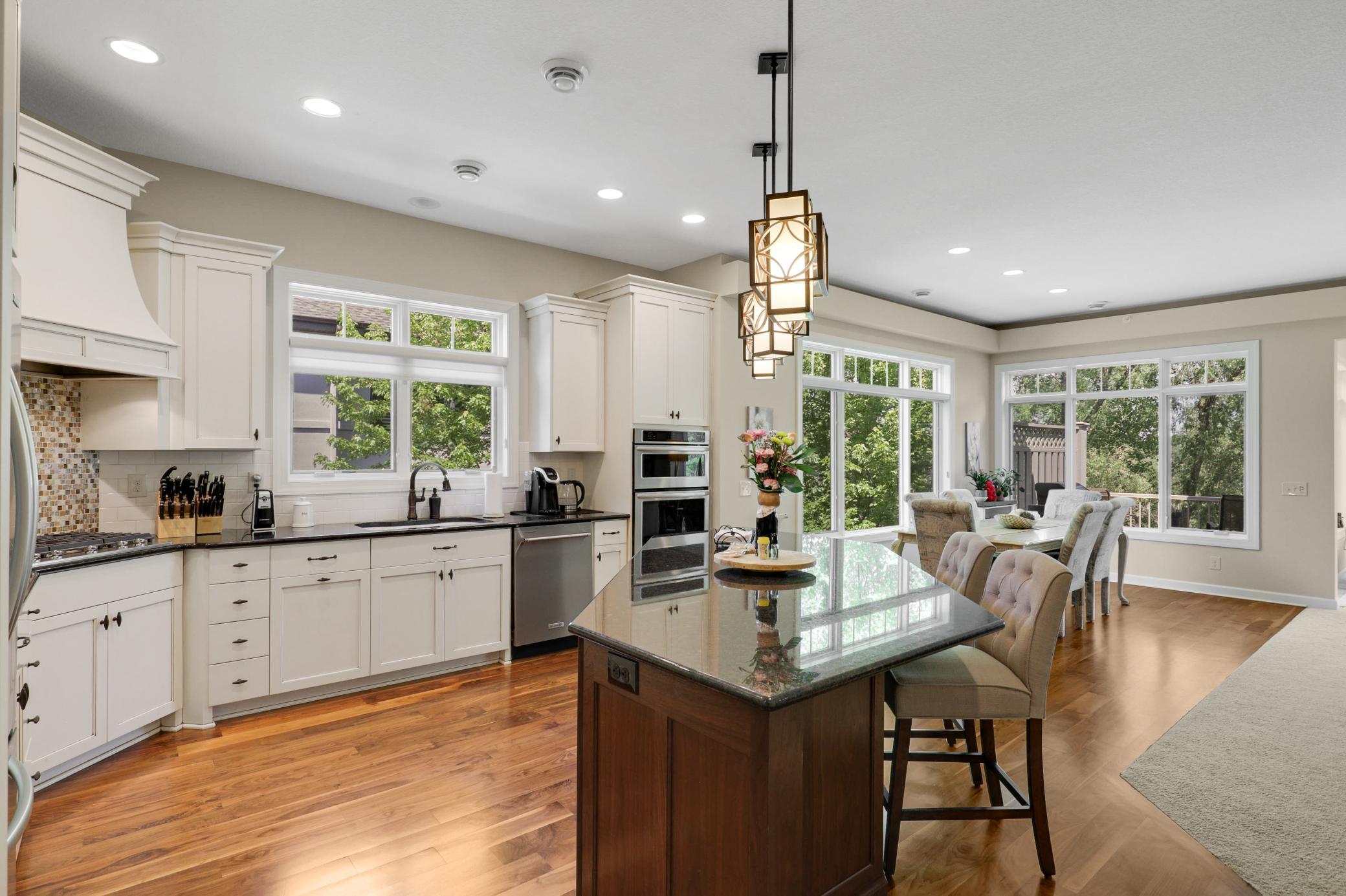 Enjoy cooking in your gourmet kitchen which showcases stone countertops, ample cabinet storage and stainless steel KitchenAid appliances.