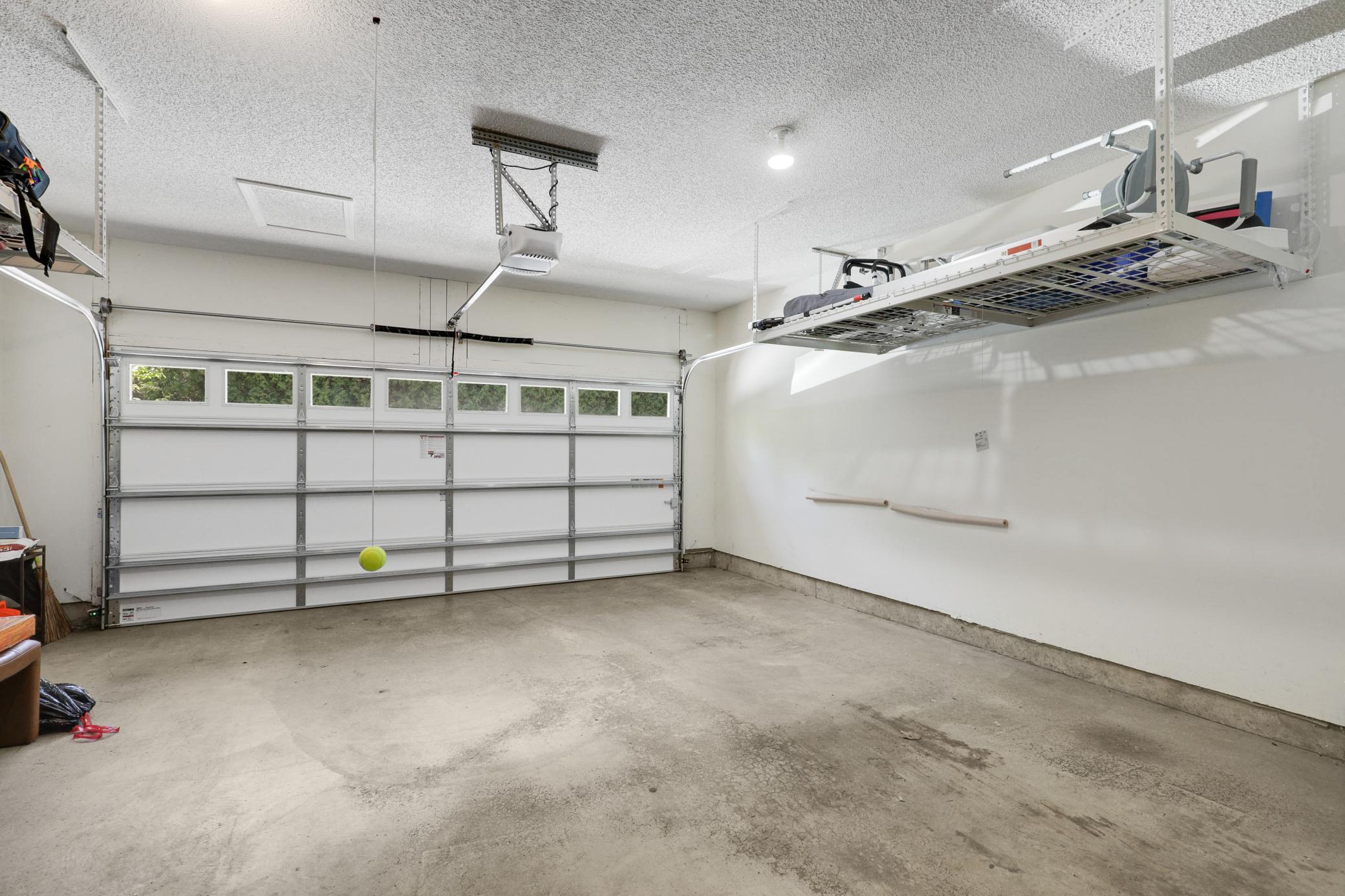 The insulated, finished, tuck-under two-car garage is accessible via the private elevator or stairs from both levels, delivering the perfect blend of luxury, comfort, and lock-and-leave convenience.