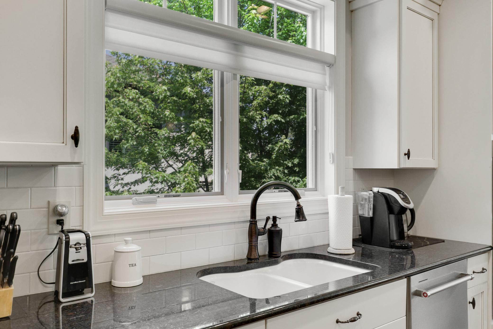 Enjoy cooking in your gourmet kitchen which showcases stone countertops, ample cabinet storage and stainless steel KitchenAid appliances.