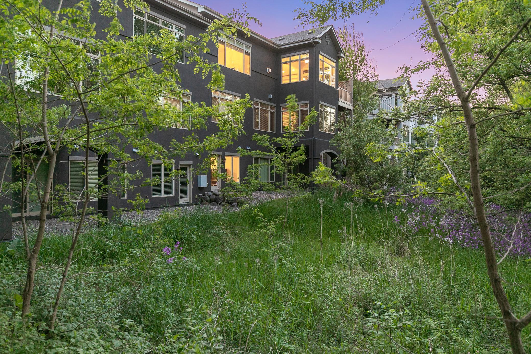 The backyard provides serene views overlooking the maturely wooded and vast, protected wetland area.